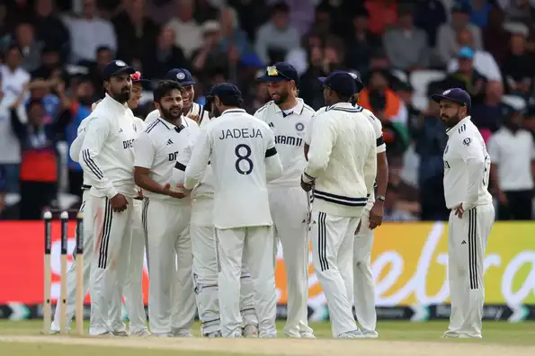 Indian fielders lament missed catch during the Test.